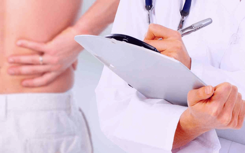 doctor prescribes treatment for lower back pain